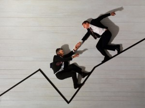 Business men climbing up graph